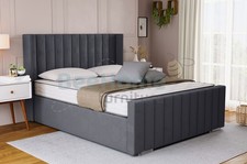 UPHOLSTERED WING PANEL OTTOMAN